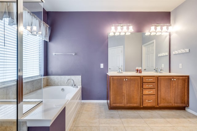 bathroom featuring vanity, tile patterned floors, and a tub