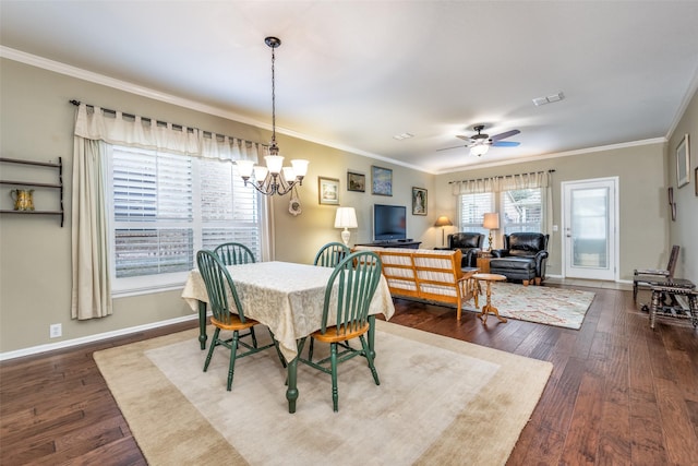 dining room with hardwood / wood-style floors, ceiling fan with notable chandelier, and ornamental molding