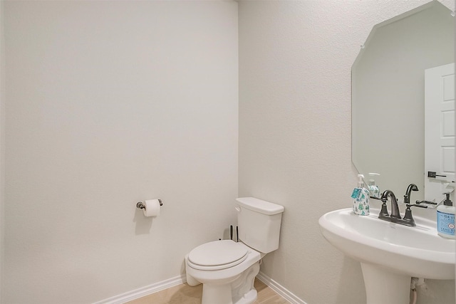 333 Pasture Dr, Midlothian, TX 76065 - half bathroom featuring toilet and a sink