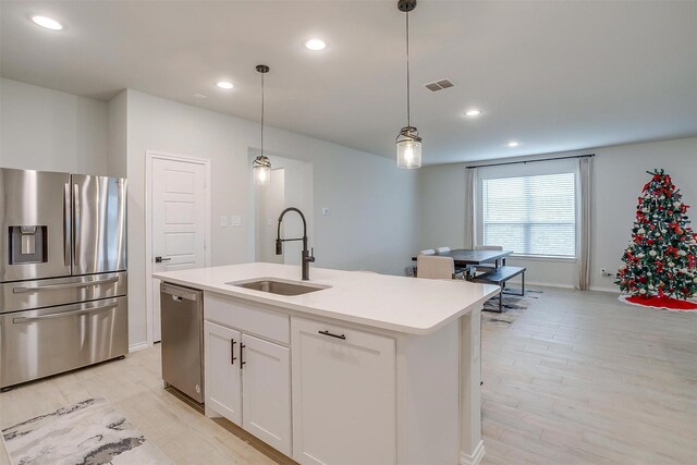 333 Pasture Dr, Midlothian, TX 76065 - kitchen featuring appliances with stainless steel finishes, white cabinets, pendant lighting, recessed lighting, and light countertops