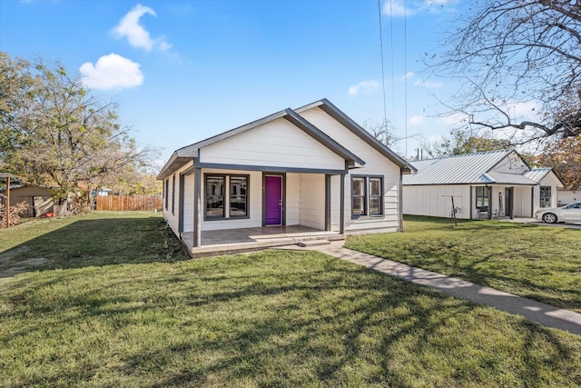 bungalow-style house featuring a porch and a front yard