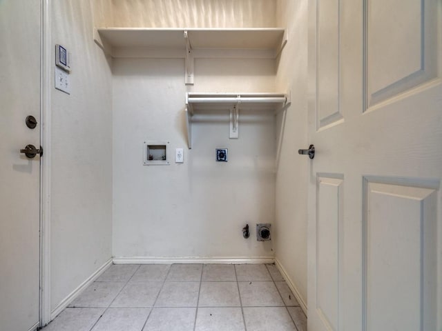 clothes washing area with washer hookup, hookup for a gas dryer, light tile patterned floors, and electric dryer hookup