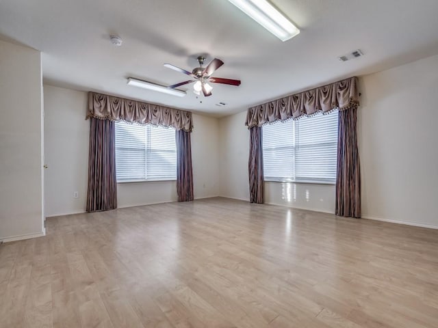 unfurnished room with ceiling fan and light hardwood / wood-style floors