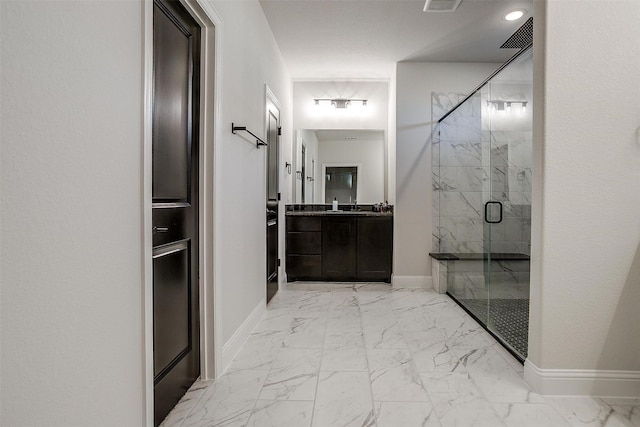 5214 Rowlan Row, Midlothian, TX 76065 - bathroom featuring marble look tiles, a marble finish shower, and vanity