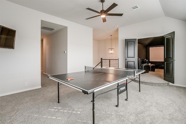 rec room with carpet, ceiling fan with notable chandelier, and lofted ceiling