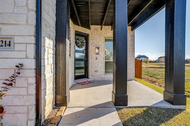 property entrance with a patio area