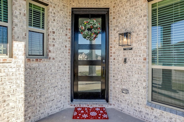 5214 Rowlan Row, Midlothian, TX 76065 - doorway to property featuring brick siding and covered porch