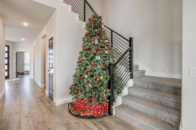 stairs with hardwood / wood-style flooring