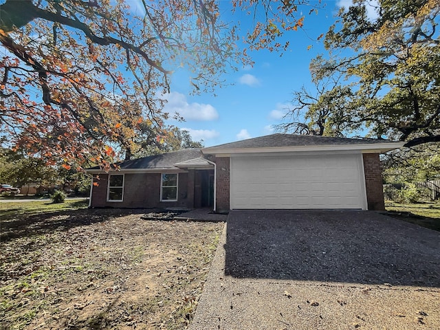 ranch-style home featuring a garage