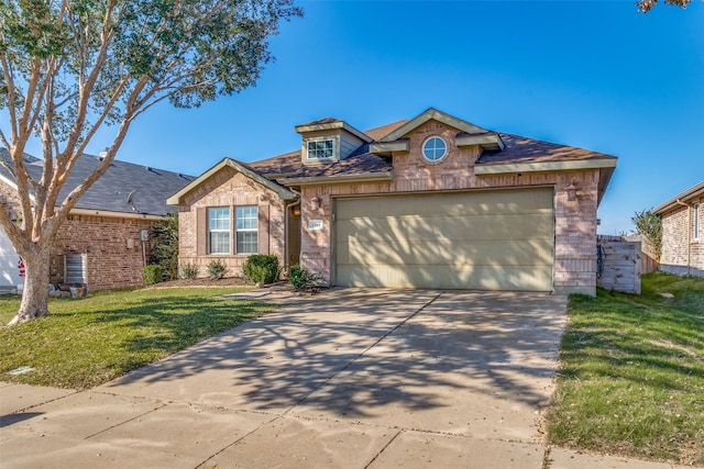 view of front facade with a garage and a front yard