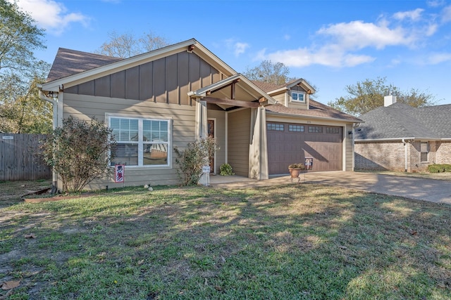 view of front of home featuring a garage and a front yard