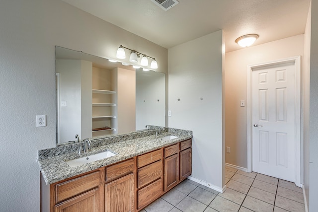 bathroom with vanity and tile patterned floors