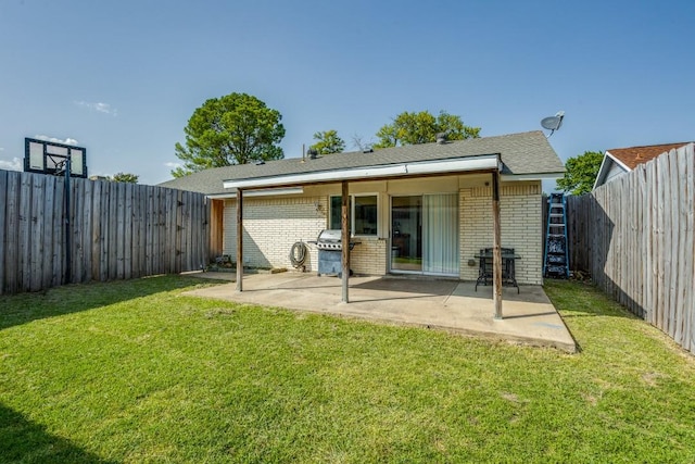 rear view of property with a patio area and a yard