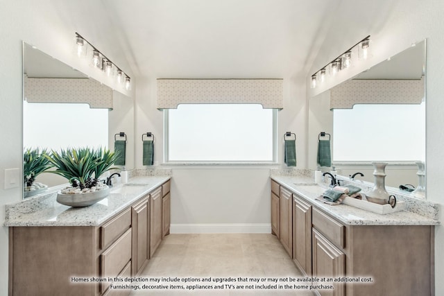 bathroom with vanity and vaulted ceiling