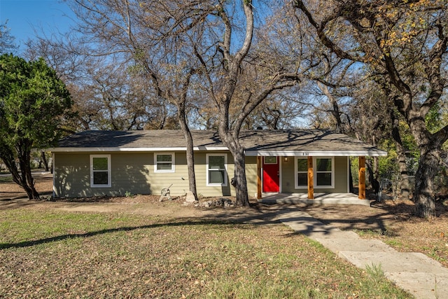 ranch-style house with a porch and a front yard