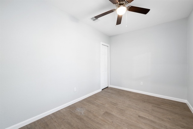 unfurnished room featuring hardwood / wood-style flooring and ceiling fan