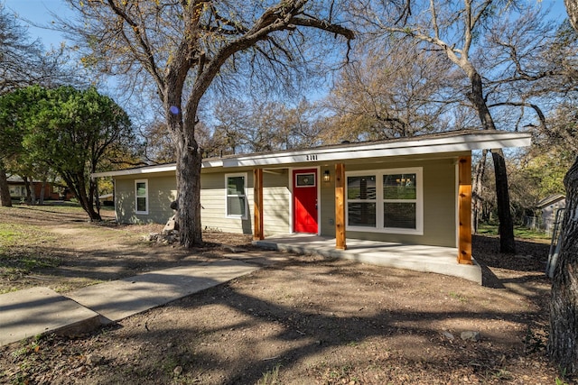 ranch-style house with covered porch