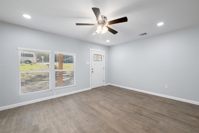 empty room featuring ceiling fan and hardwood / wood-style floors