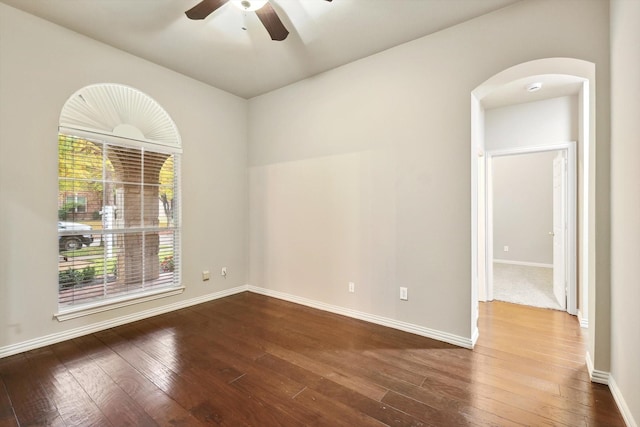 unfurnished room with hardwood / wood-style flooring and ceiling fan