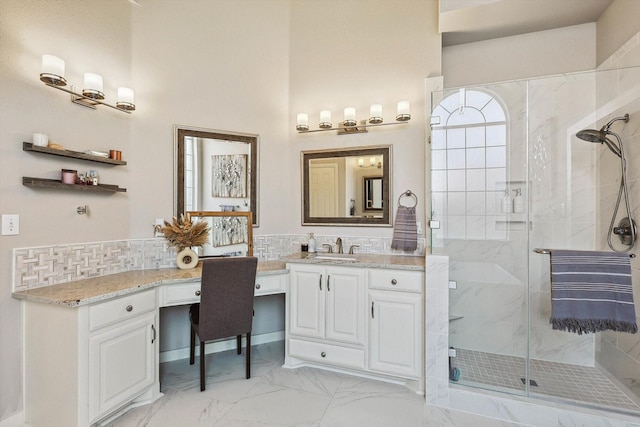 2543 Sir Tristram Ln, Lewisville, TX 75056 - bathroom featuring a marble finish shower, vanity, marble look tiles, and tasteful backsplash