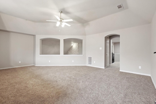 2543 Sir Tristram Ln, Lewisville, TX 75056 - empty room with a ceiling fan, carpet, arched walkways, and baseboards