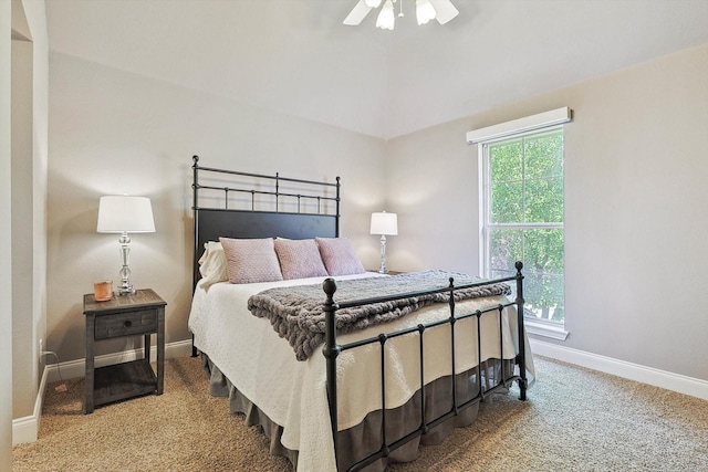 bedroom featuring ceiling fan, carpet flooring, and multiple windows