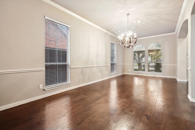 2543 Sir Tristram Ln, Lewisville, TX 75056 - unfurnished dining area with a chandelier, wood-type flooring, baseboards, and crown molding