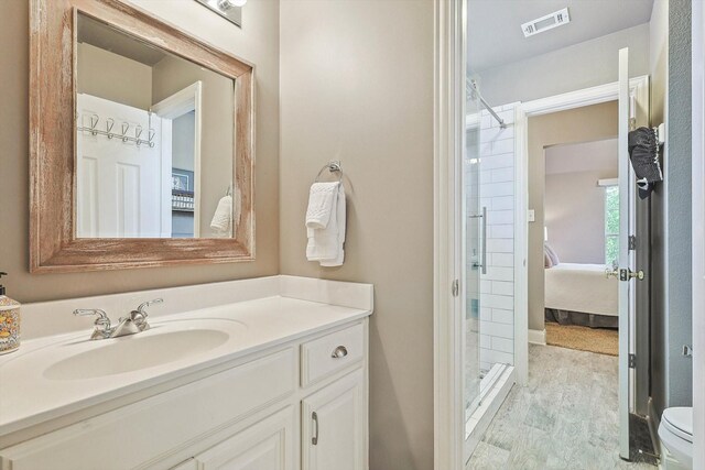 bathroom with a shower, toilet, and vanity