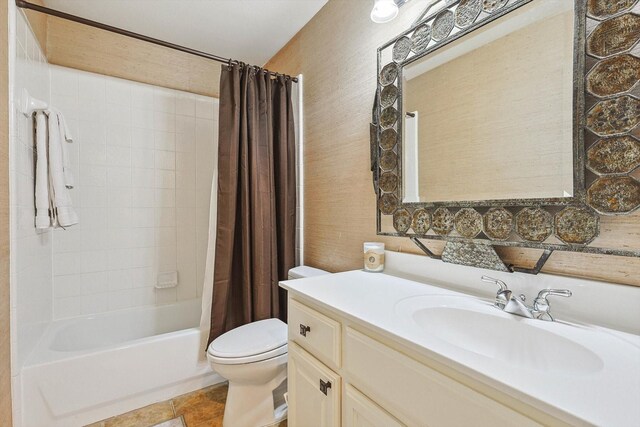 full bathroom featuring toilet, shower / bath combination with curtain, tile patterned flooring, and vanity