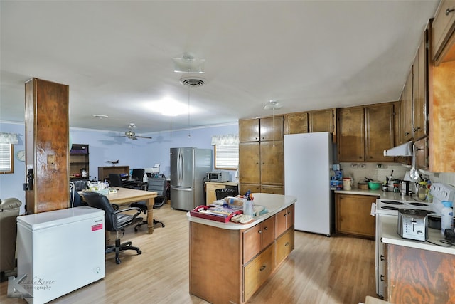 kitchen featuring ceiling fan, light hardwood / wood-style flooring, stainless steel fridge, refrigerator, and white fridge