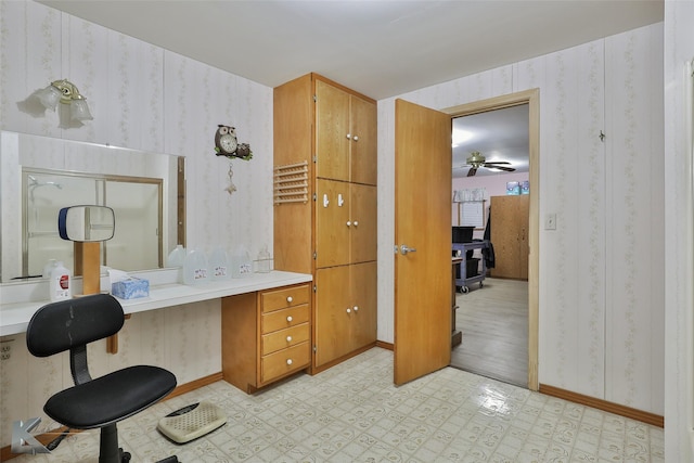 bathroom with hardwood / wood-style flooring and ceiling fan