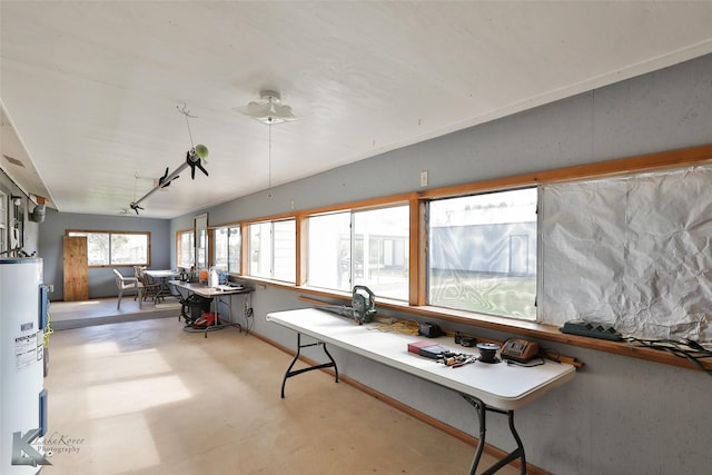 interior space with electric water heater and lofted ceiling