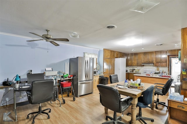 office space featuring light hardwood / wood-style flooring and ceiling fan