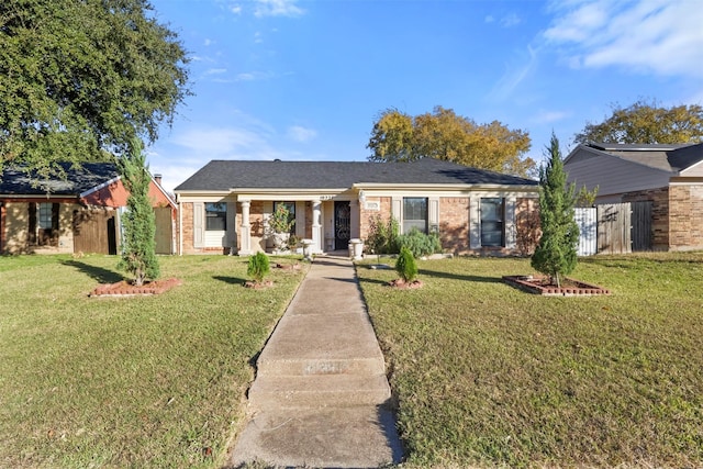 ranch-style house with a front lawn