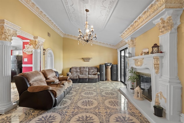 living room featuring decorative columns and ornamental molding