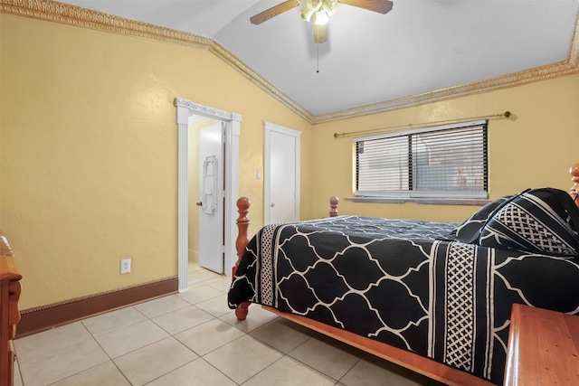 bedroom with ceiling fan, tile patterned floors, lofted ceiling, and ornamental molding