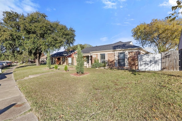 ranch-style house with a front yard