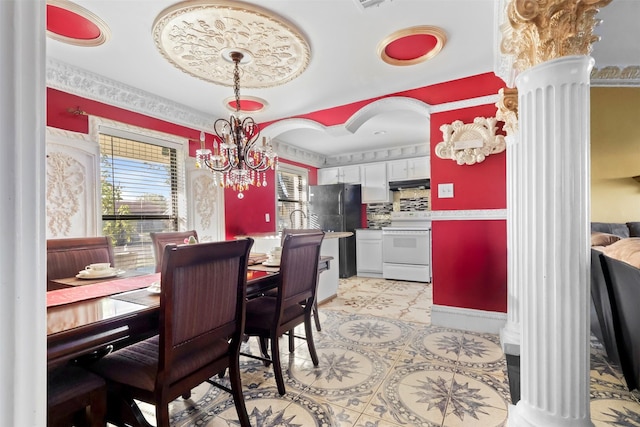 dining area with an inviting chandelier