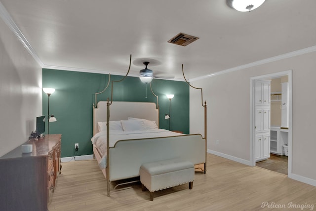 bedroom featuring crown molding and light wood-type flooring