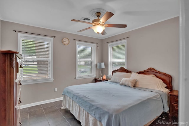 tiled bedroom featuring crown molding and ceiling fan