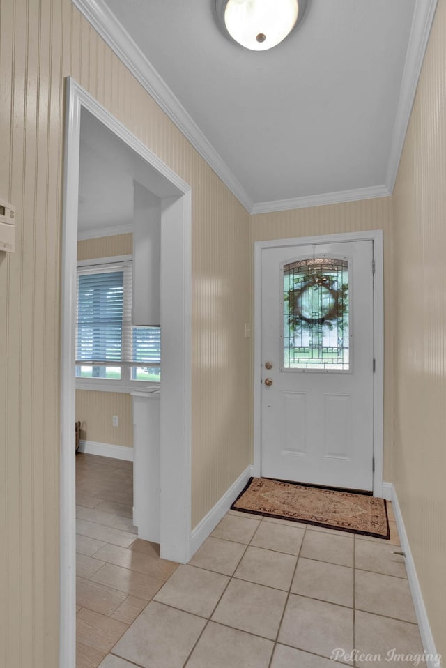 foyer entrance featuring light tile patterned floors, plenty of natural light, and ornamental molding