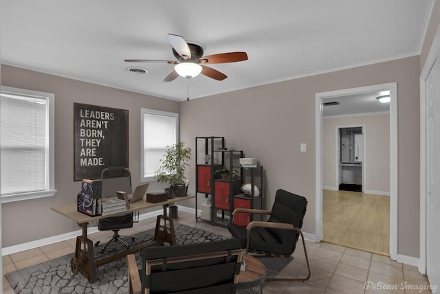 tiled home office featuring crown molding and ceiling fan