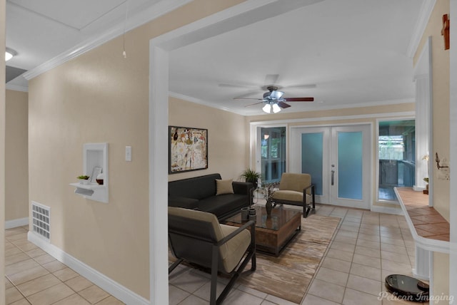 tiled living room featuring crown molding, ceiling fan, and french doors