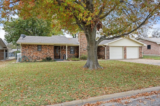 view of front of home with a garage and a front lawn