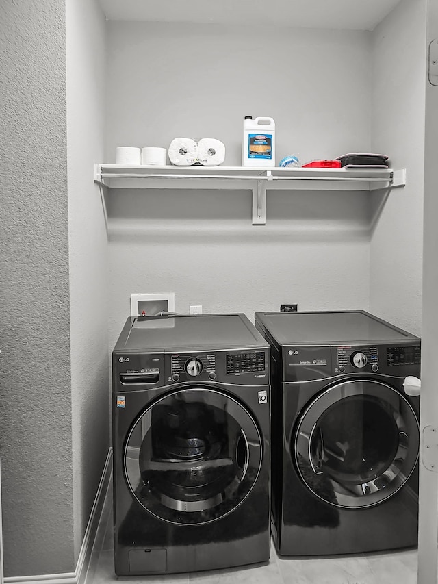 laundry area with washer and clothes dryer