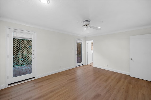 unfurnished room featuring ceiling fan, light wood-type flooring, and crown molding