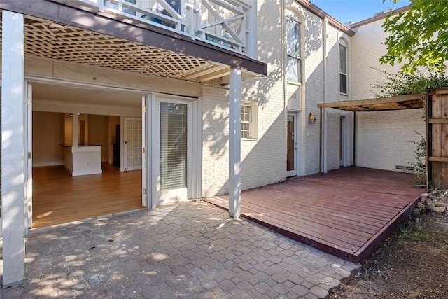 exterior space with a balcony, a deck, and a patio area