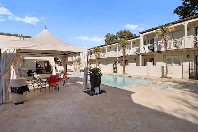 view of pool featuring a gazebo and a patio area