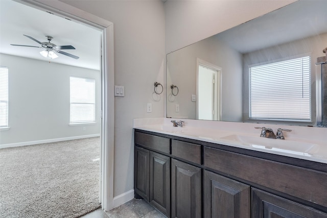 bathroom with ceiling fan and vanity