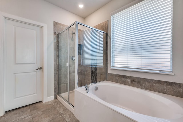 bathroom featuring shower with separate bathtub and tile patterned floors